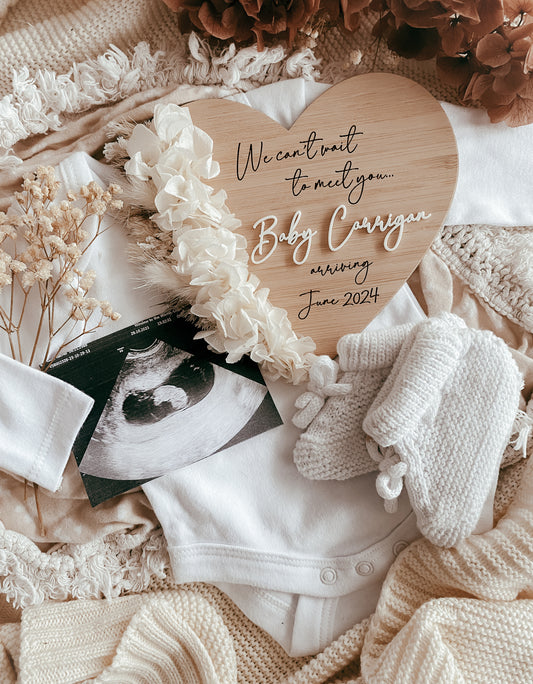 We can’t wait to meet you dried floral heart pregnancy announcement