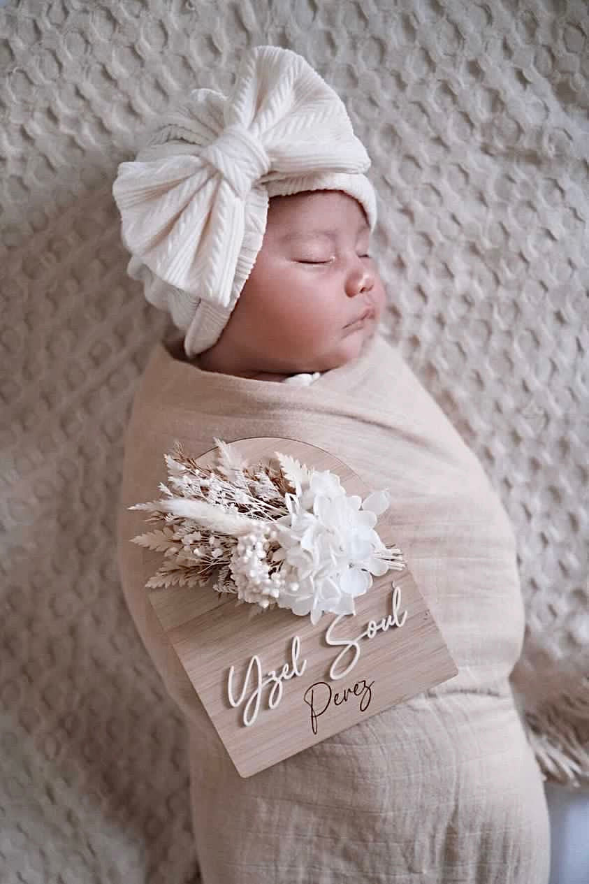 White and neutral dried flower birth announcement sign