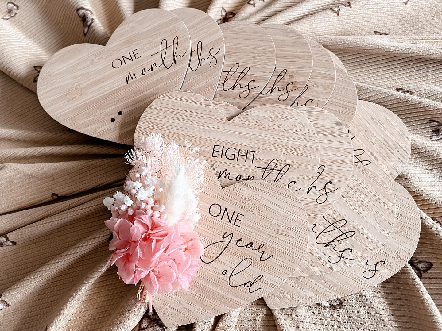 Heart shaped dried floral milestones