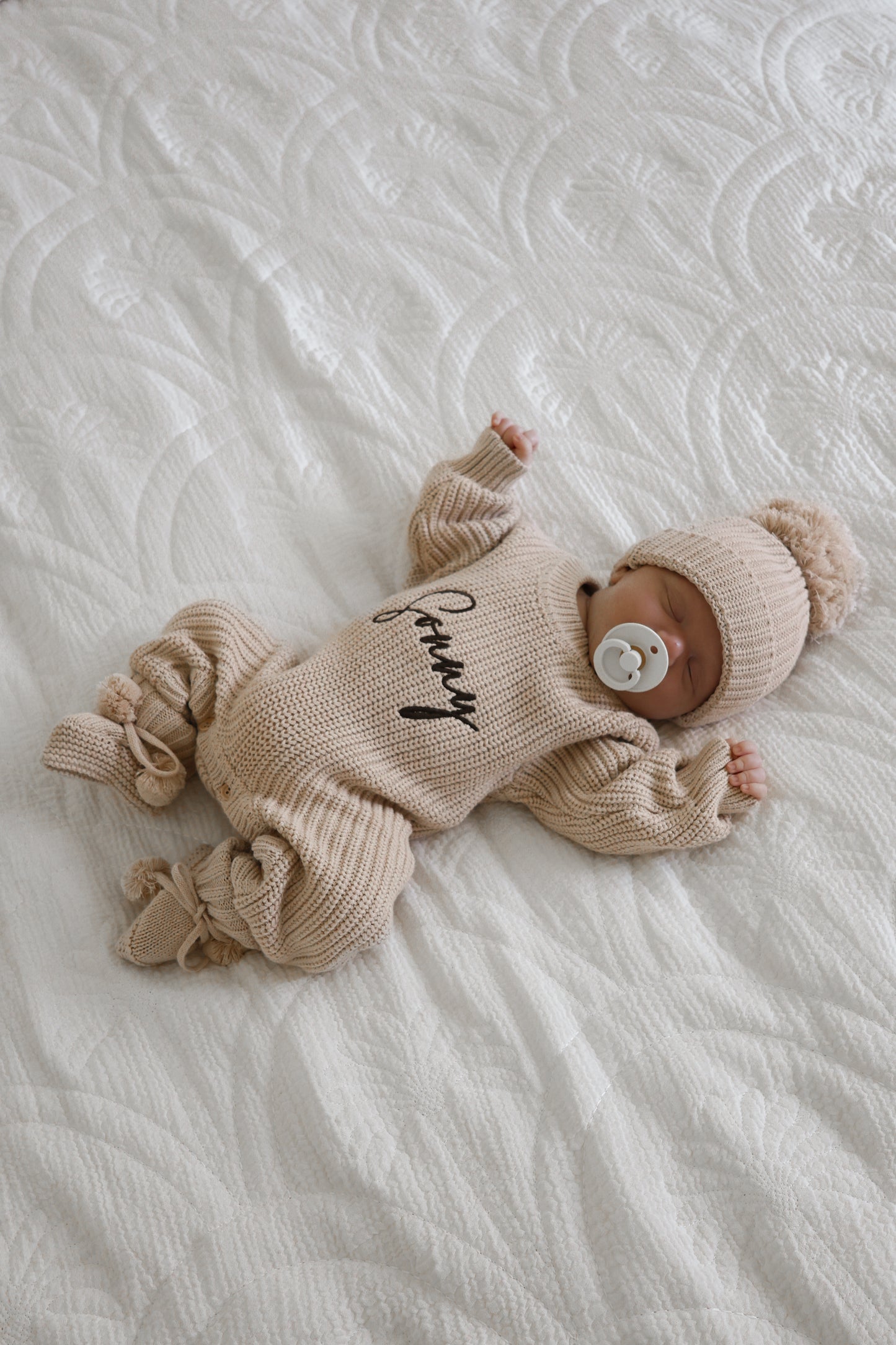 Neutral chunky knit baby announcement romper