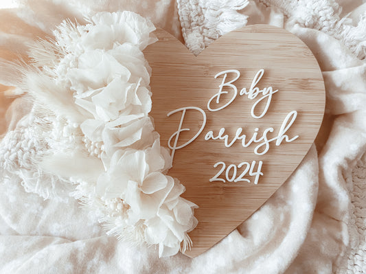 Baby “surname” heart shaped dried floral pregnancy announcement