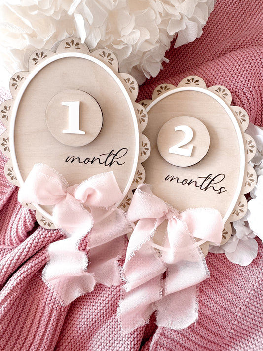 Scallop edge milestone signs with ribbon