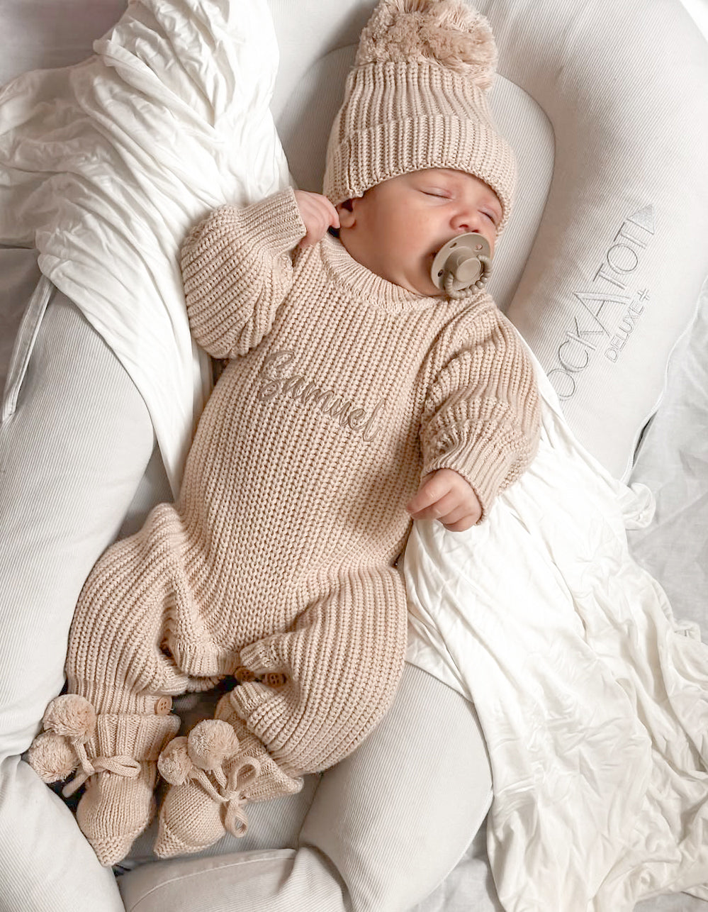 Neutral chunky knit baby announcement romper