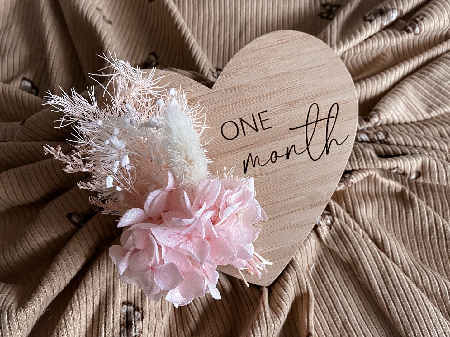 Heart shaped dried floral milestones