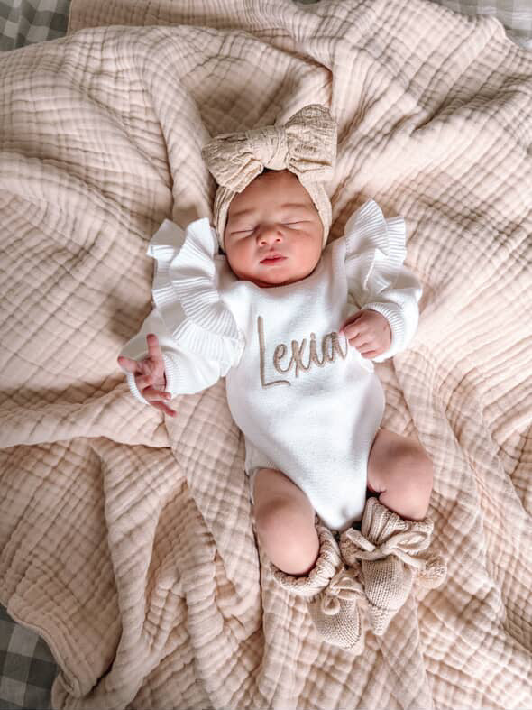 White frill shoulder baby announcement romper