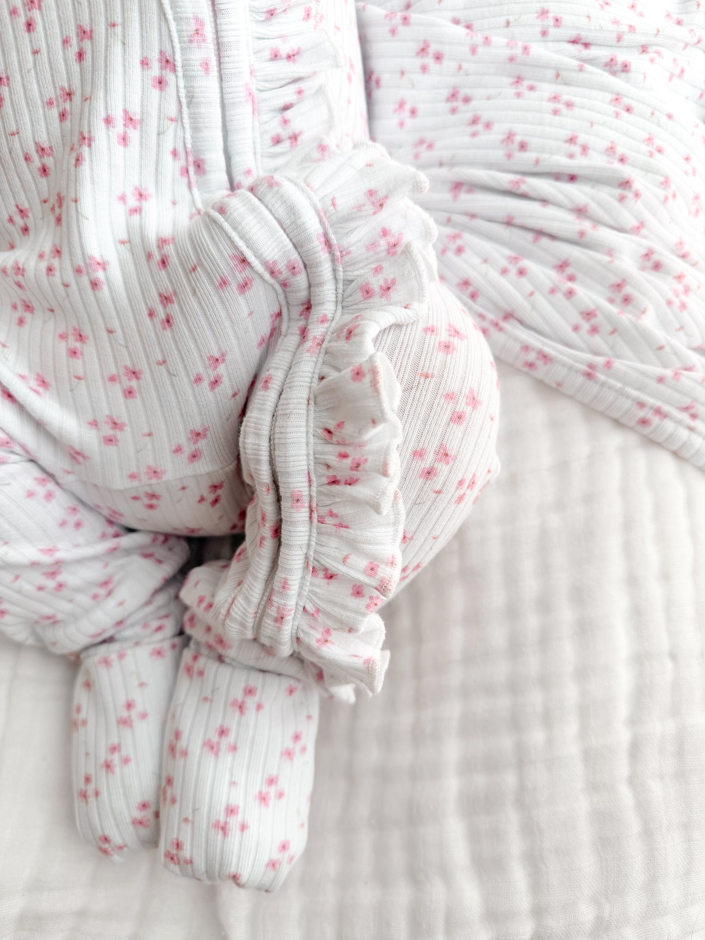 Peyton pink flower zip frill onesie