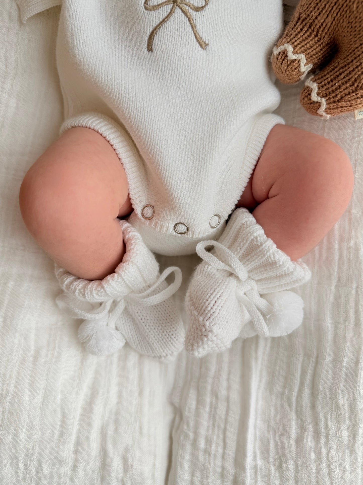 White soft knit pompom baby booties