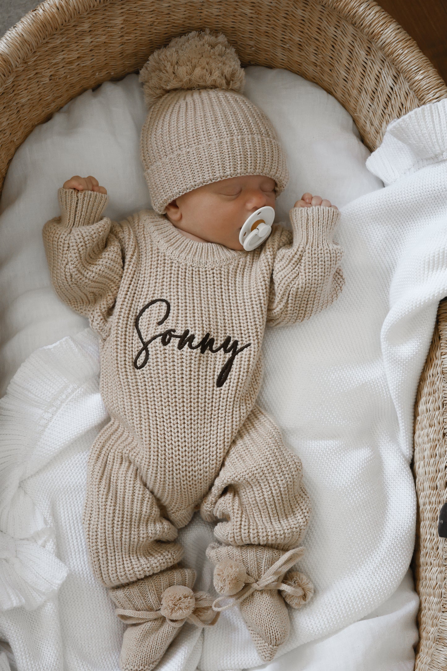 Neutral chunky knit baby announcement romper