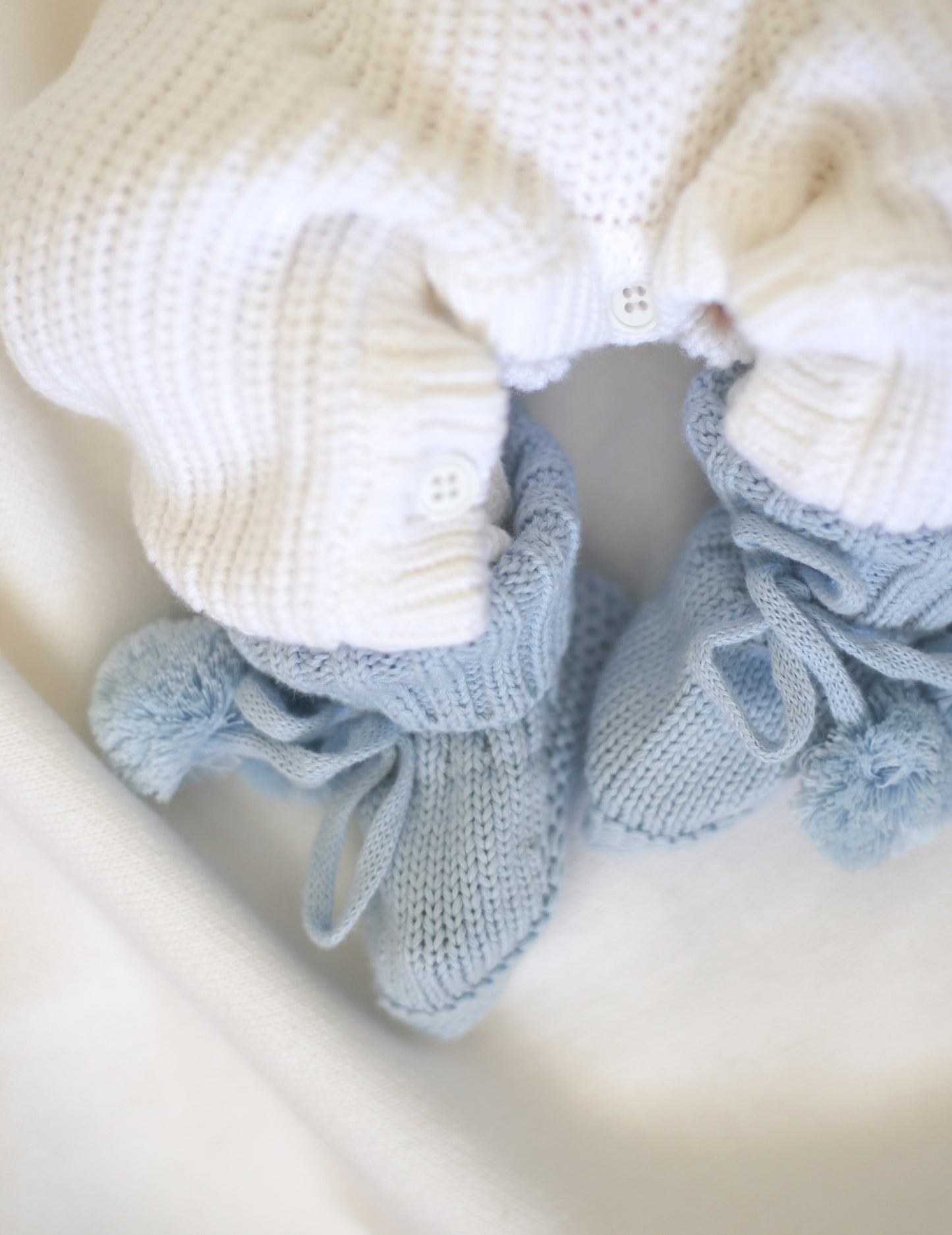 Blue knit baby pompom booties