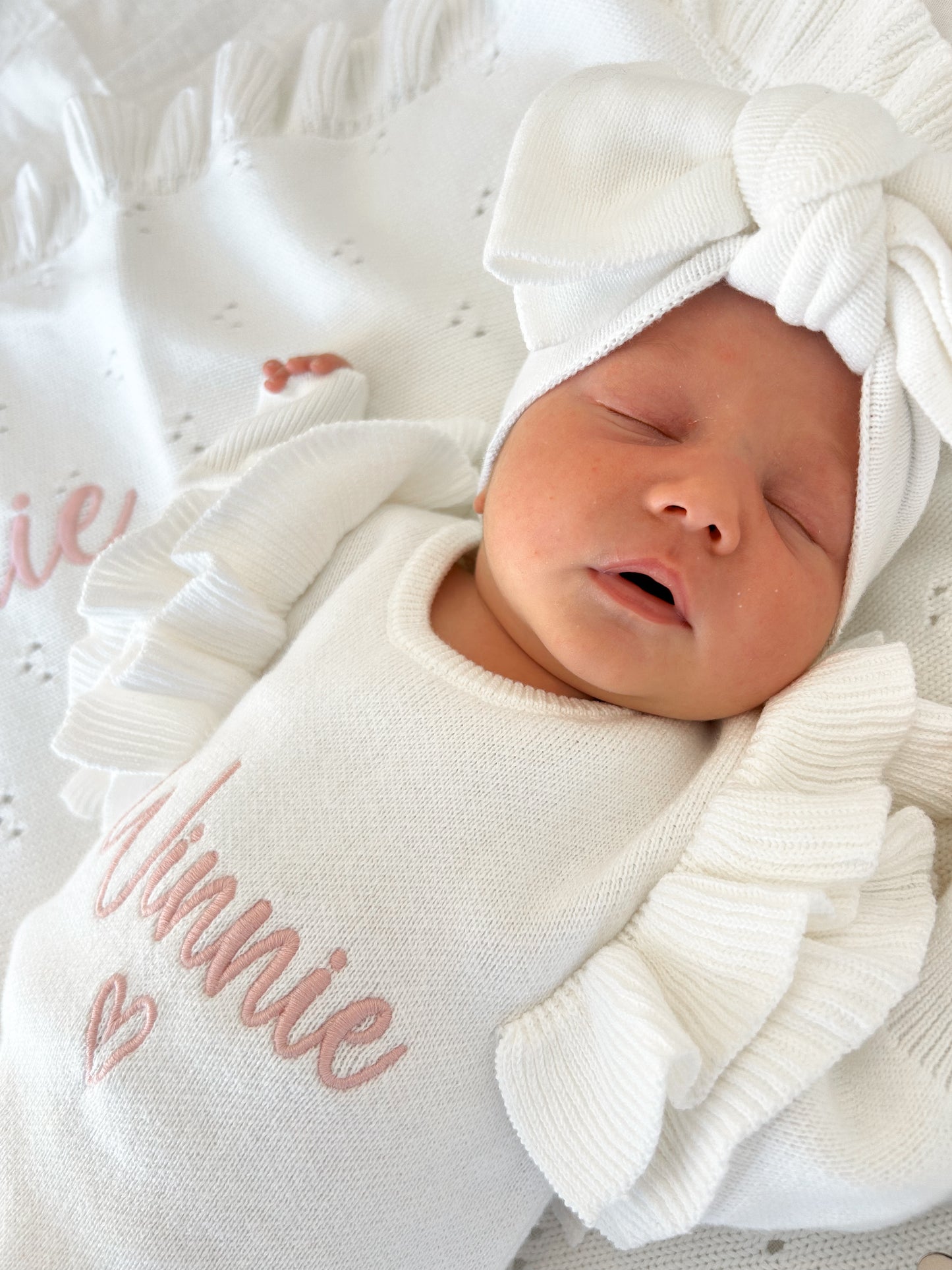 White frill heart baby name announcement romper
