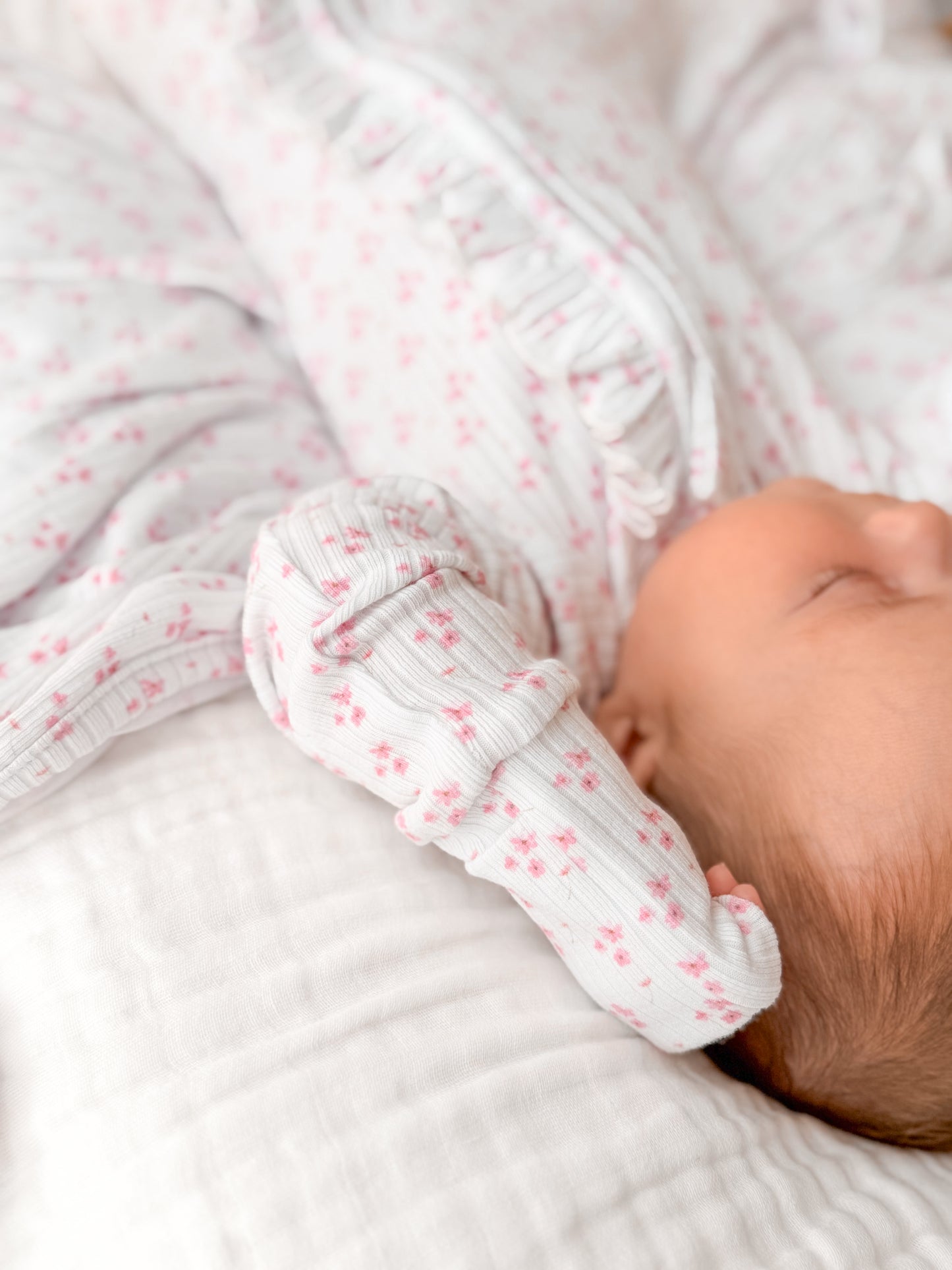 Peyton pink flower zip frill onesie