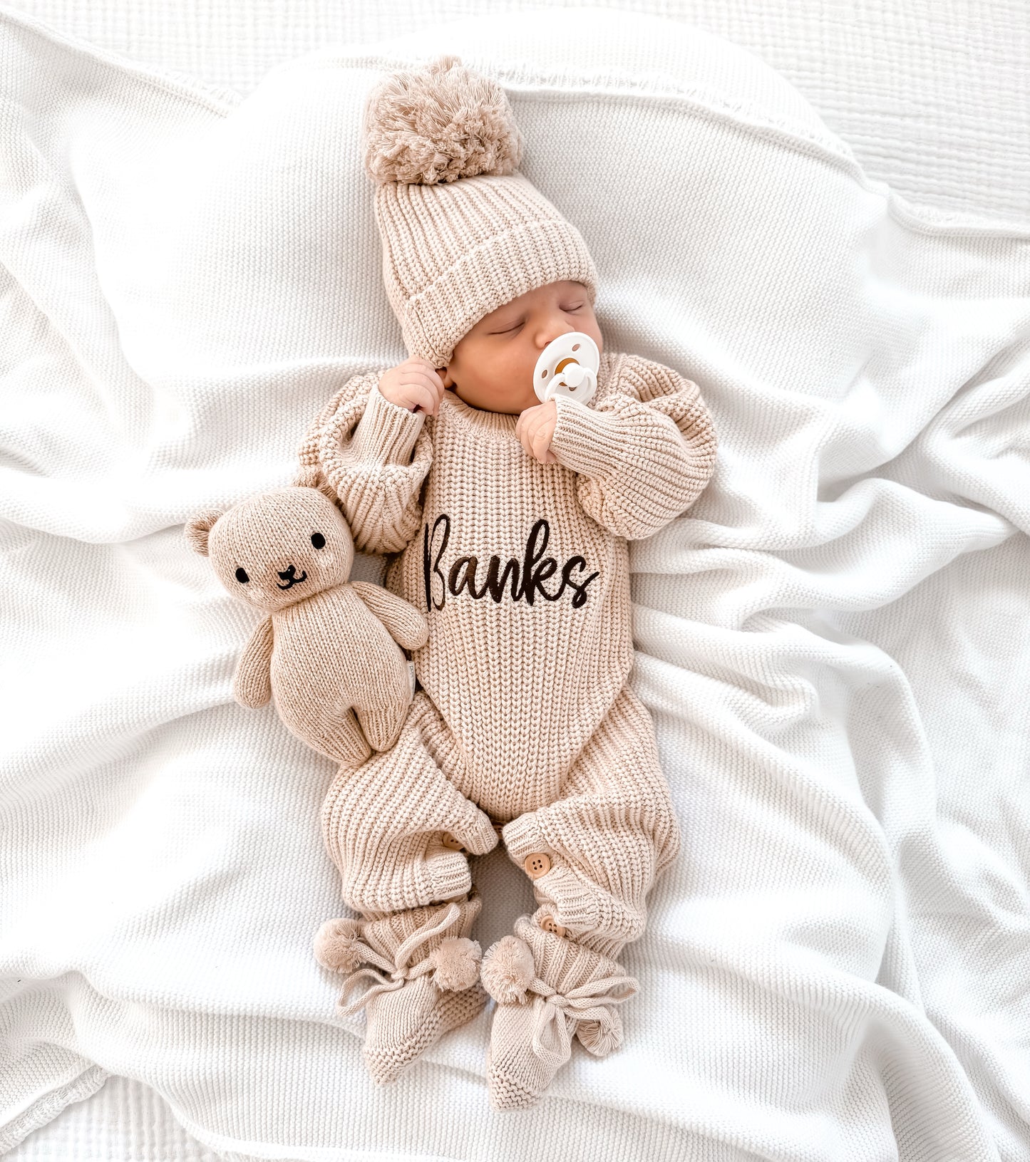 Neutral chunky knit baby announcement romper