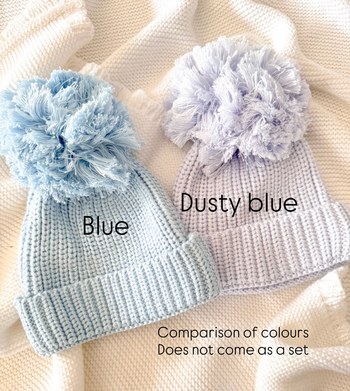 Blue knit pompom newborn hat