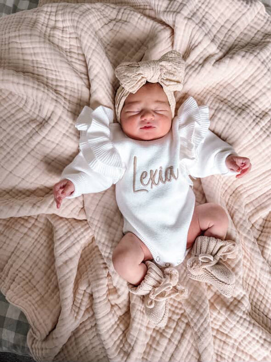 White frill shoulder baby announcement romper