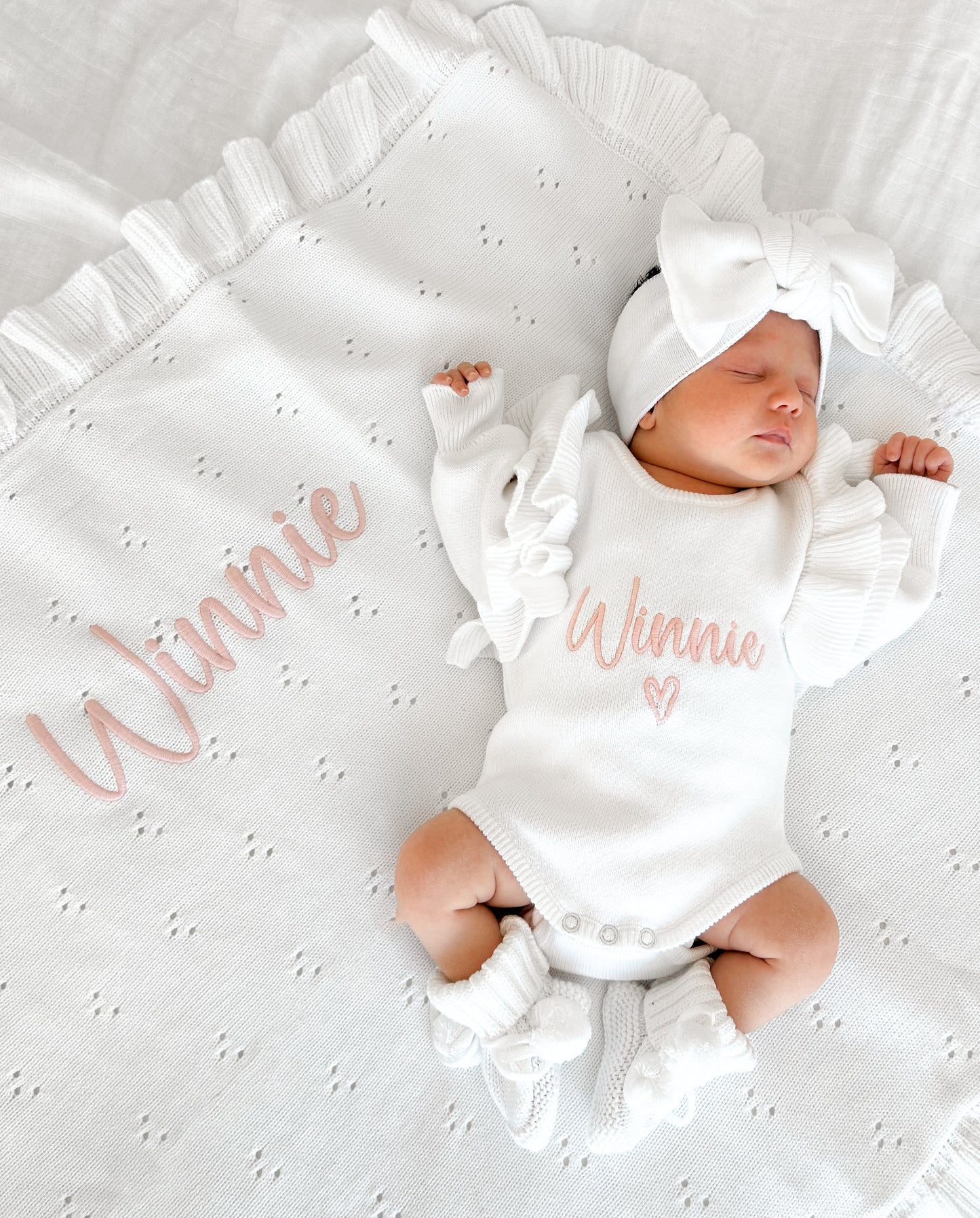 White frill heart baby name announcement romper