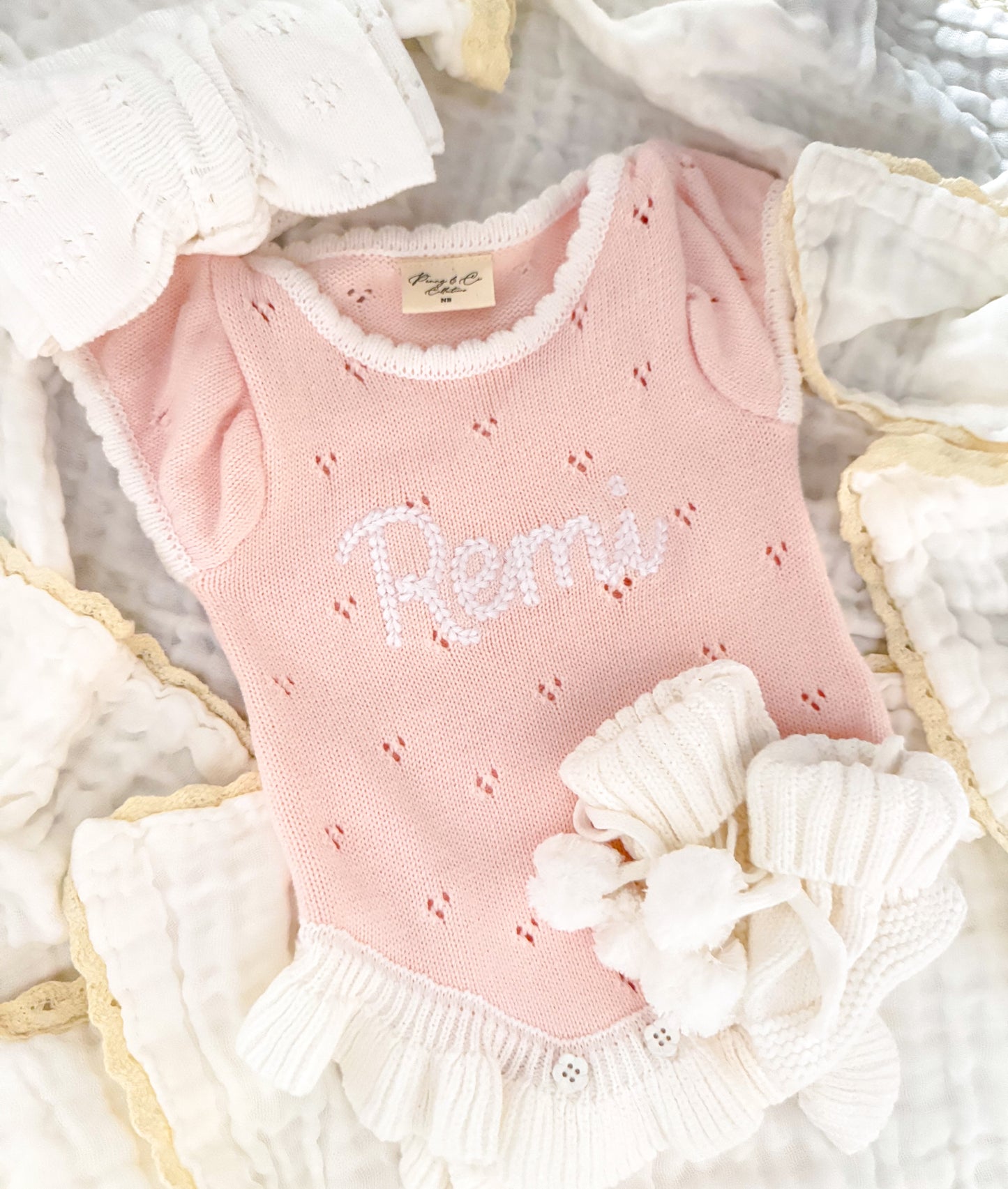 Pink frill pointelle baby girl announcement romper