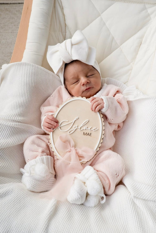Scallop edge birth announcement sign with ribbon