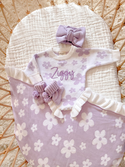 Reversible purple and white flower blanket