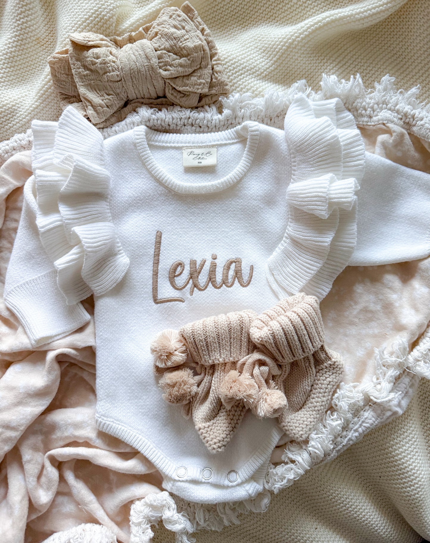 White frill shoulder baby announcement romper