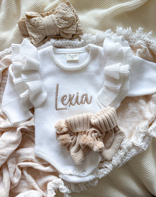 White frill shoulder baby announcement romper