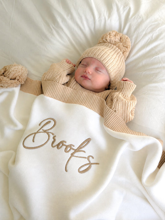 White with beige trim pompom baby blanket