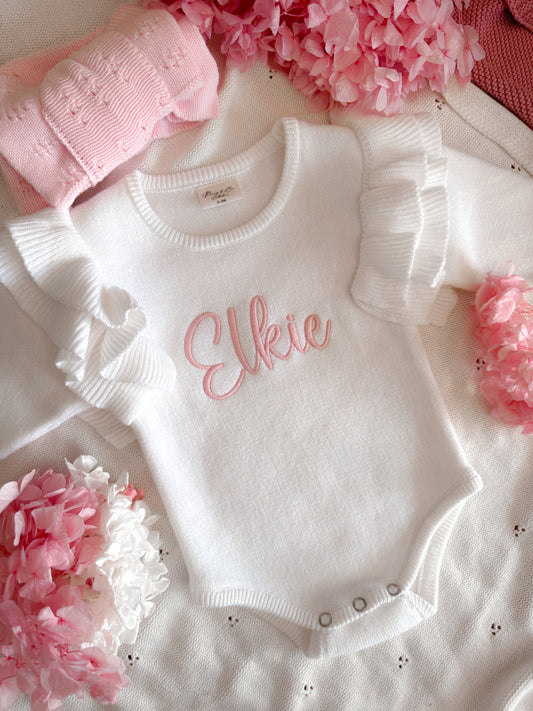 White frill shoulder baby announcement romper