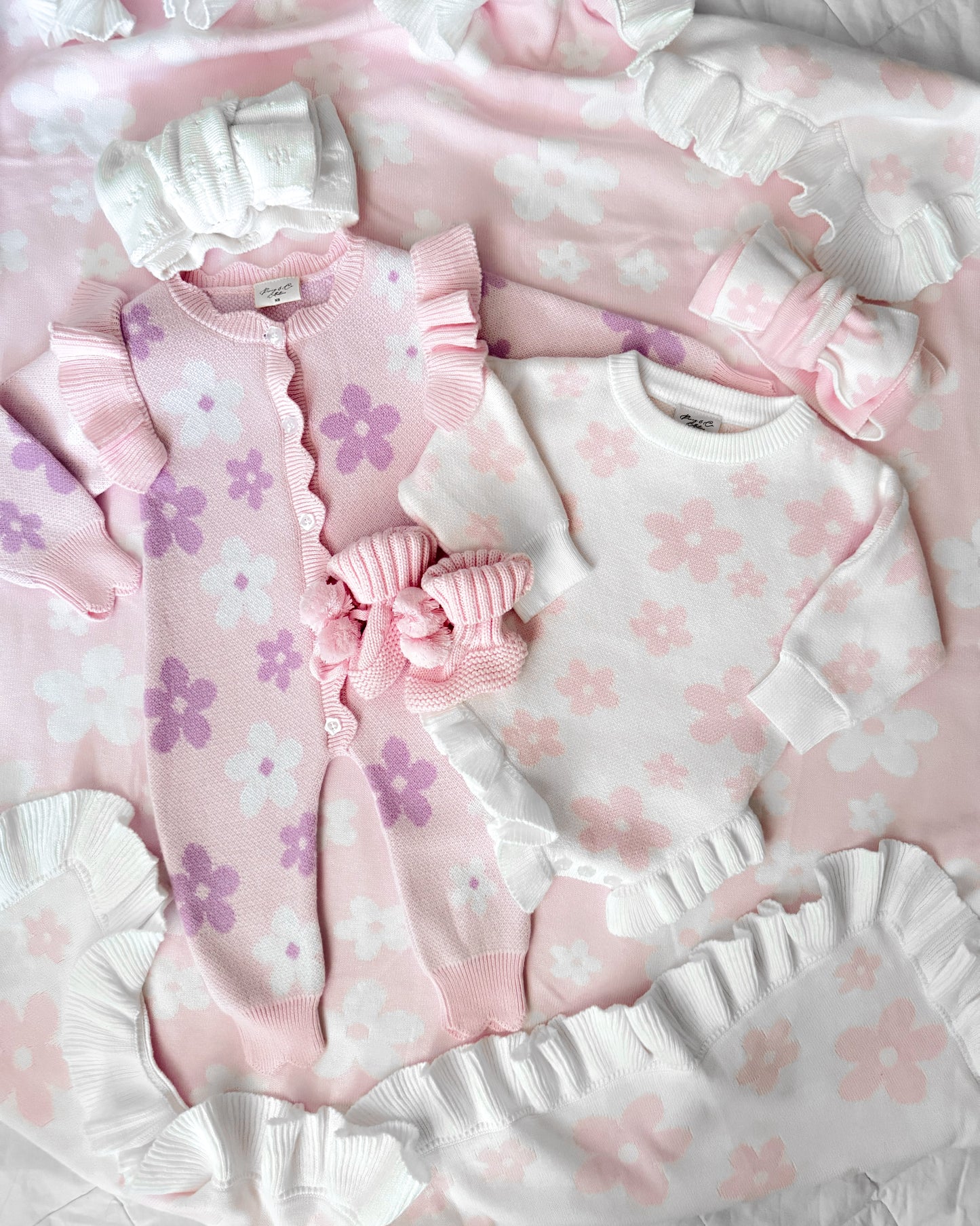 Pink and purple flower pattern baby romper