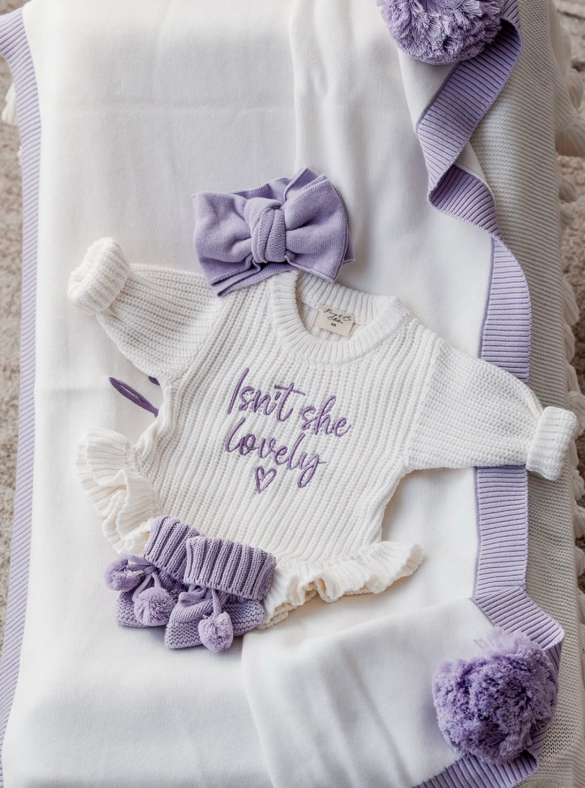 Isn’t she lovely lilac baby announcement romper