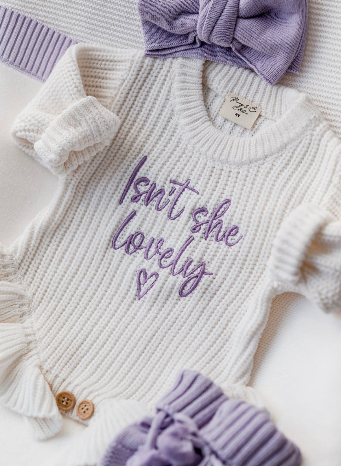 Isn’t she lovely lilac baby announcement romper