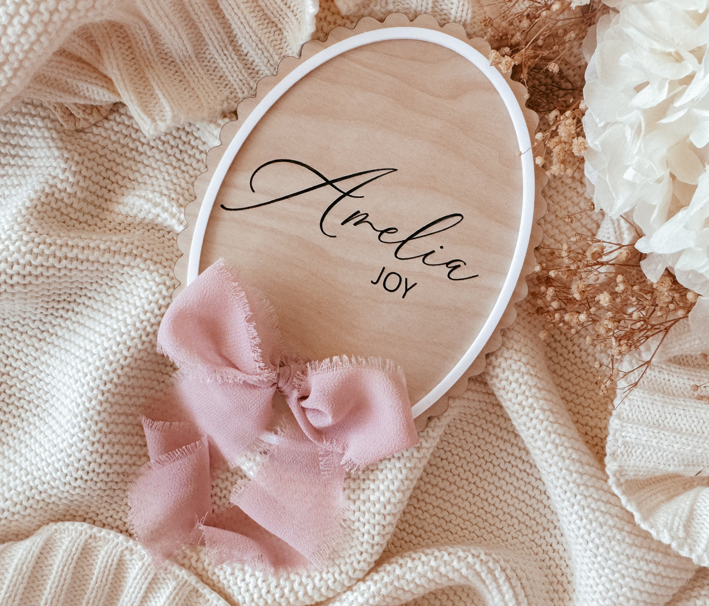 Scallop edge birth announcement sign with ribbon