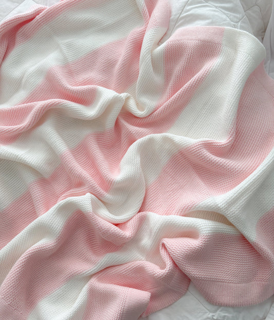 White and baby pink stripe knit blanket