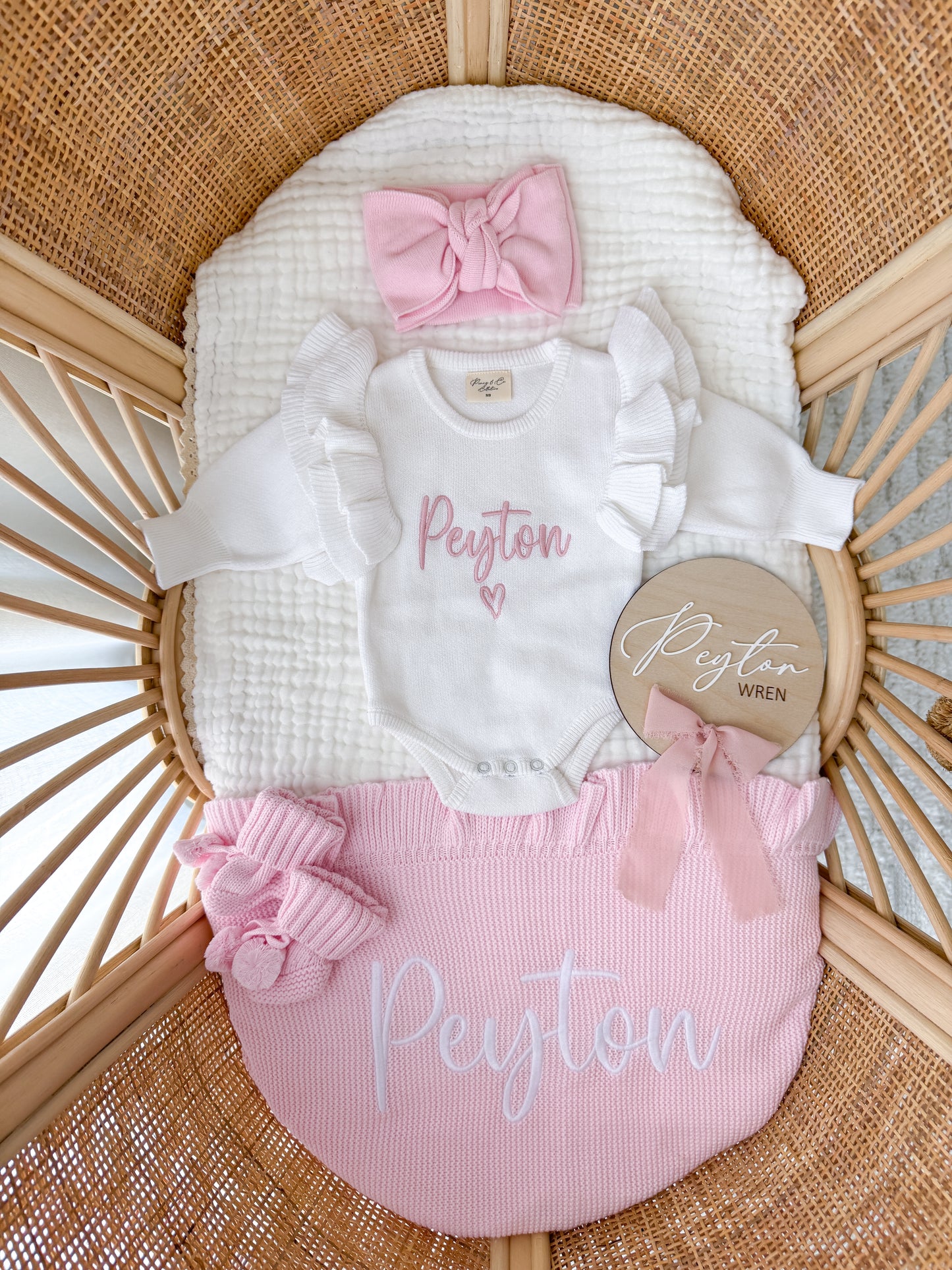 White frill heart baby name announcement romper