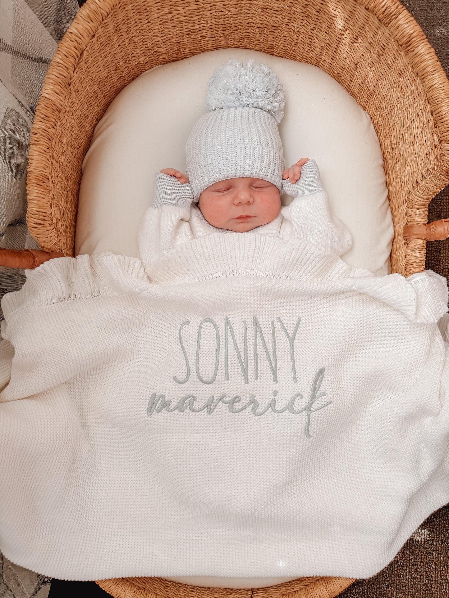Different fonts white knit baby name blanket