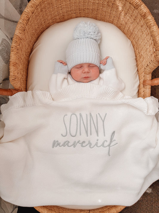 Different fonts white knit baby name blanket
