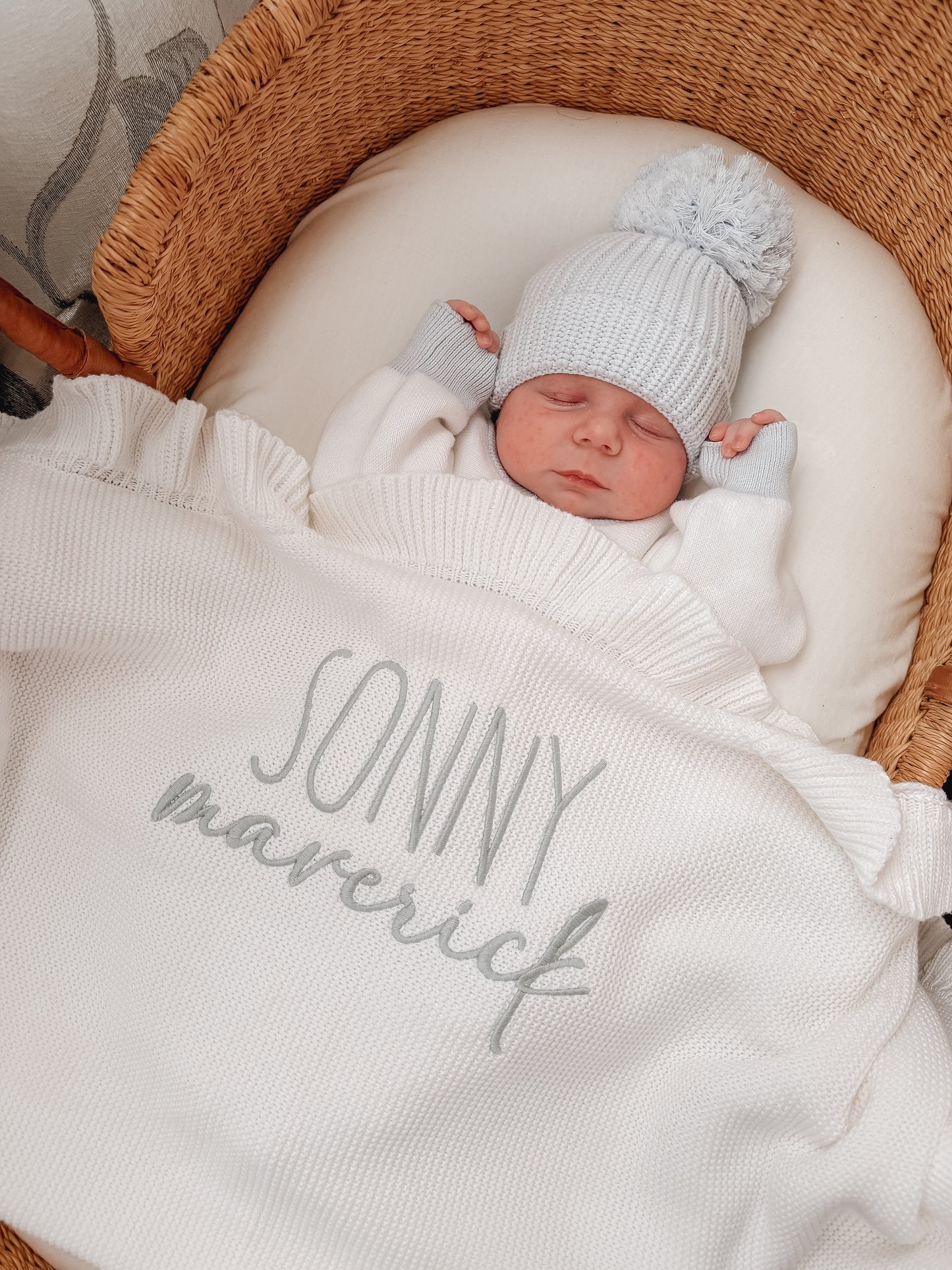 Different fonts white knit baby name blanket