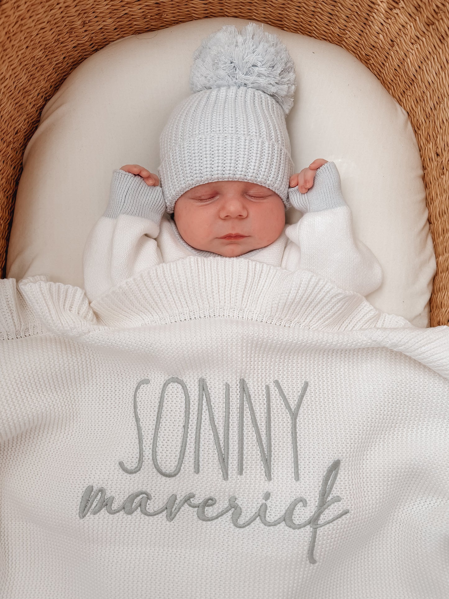 Different fonts white knit baby name blanket